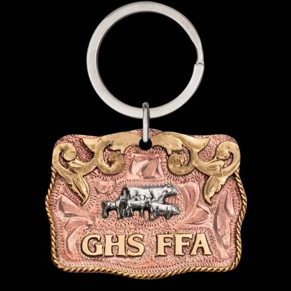 "Our Honkytonk Man Custom Keychain is expertly hand-engraved on a Copper base, accented with Western-inspired scrolls, lettering, and a traditional rope edge in Jeweler's Bronze. This keychain offers unlimited design options—from metal colors and fig